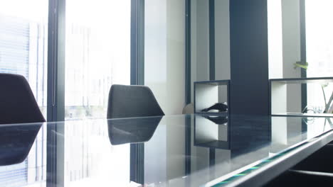empty conference room with glass table and chairs, modern office setting, copy space