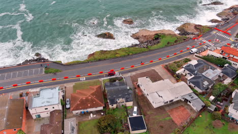 Repairing-storm-damage-along-West-Cliff-Drive,-Santa-Cruz,-California---aerial