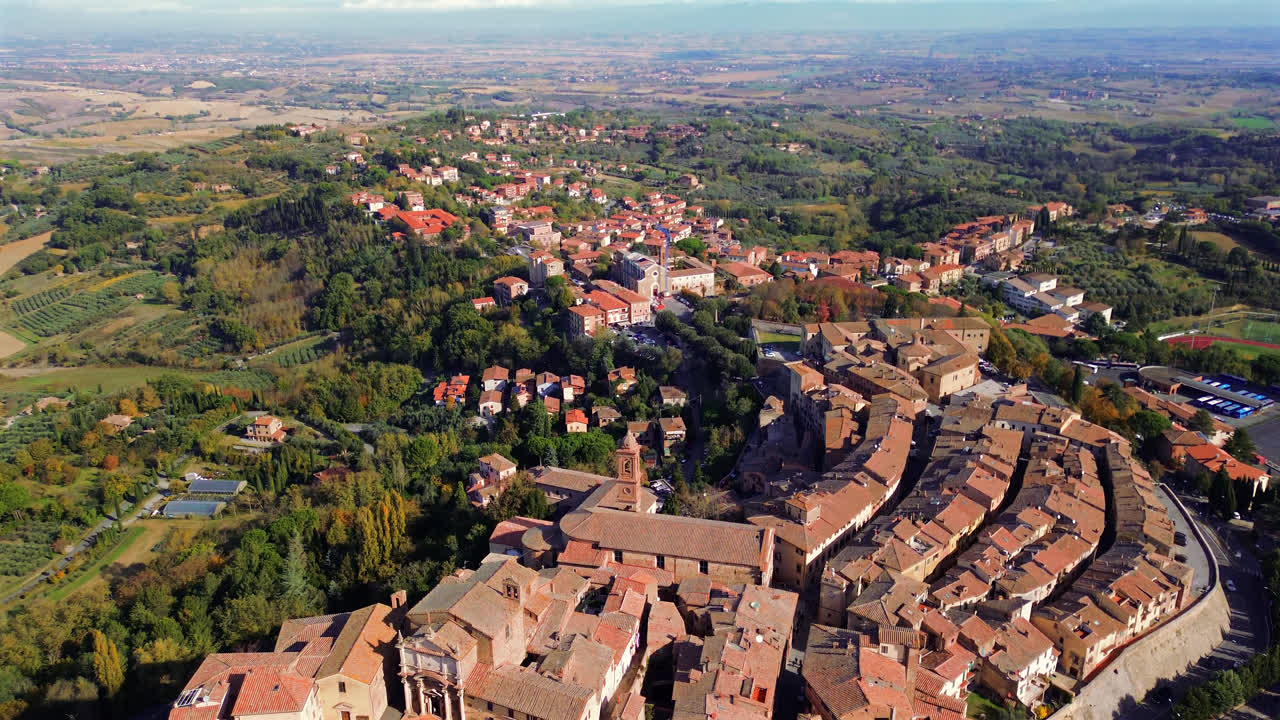 Aerial of Tuscan hillside village of Montepulciano with terracotta roofs and renaissance charm