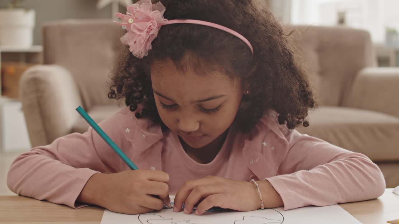 Girl Drawing and Smiling on Camera