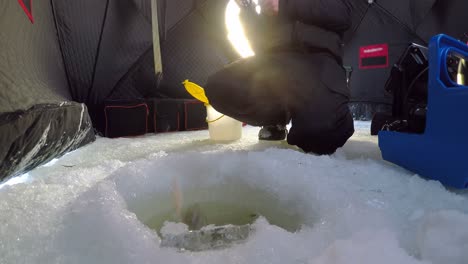 man fishing in snowy region