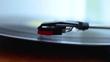 old record player with vinyl disc playing music