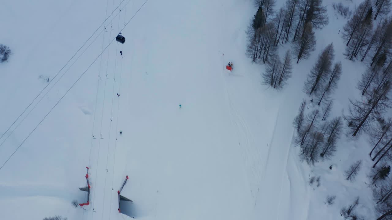 Aerial of busy skiresort, revealing the beautiful snow covered town of Saas-Fee in Switzerland