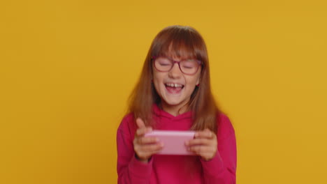 Worried-excited-child-girl-playing-racing-or-shooter-simulator-gadget-app-video-games-on-smartphone