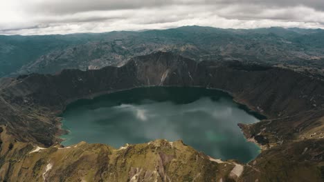 scenic view of quilotoa crater lake in ecuador - aerial drone shot