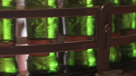 beer bottles on automated production line at brewery factory