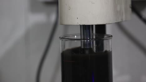 safety first concept, soil testing, female biologist in white coat pouring water into test tube with dissolved samples of soil in laboratory, agrochemical examination of soil