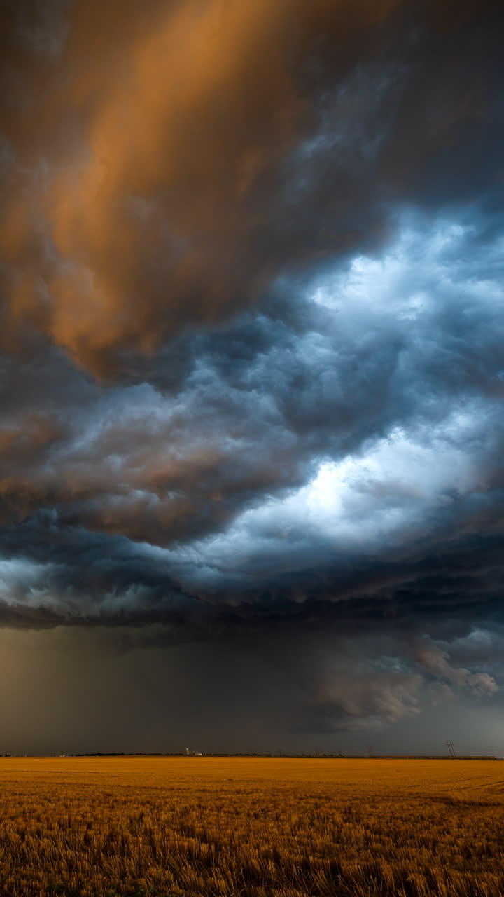Expansive cloudscape of storm clouds under dark dramatic sky showing extreme weather and climate forces