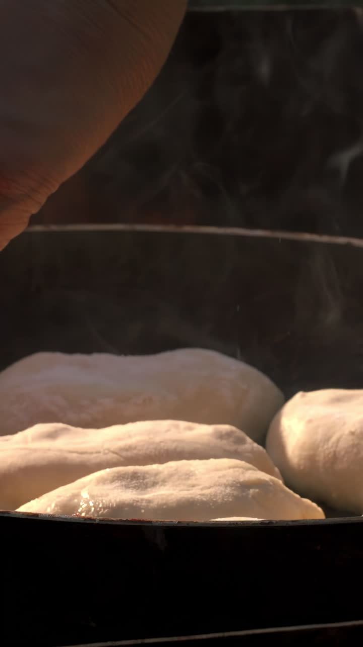 Cooking Bread in a Pan over an Open Flame