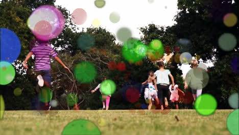 moving spots of coloured light with children running