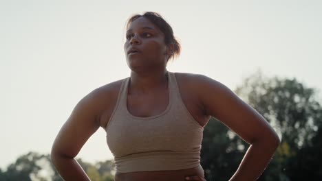 African-American-woman-breathing-after-the-running-at-the-park.