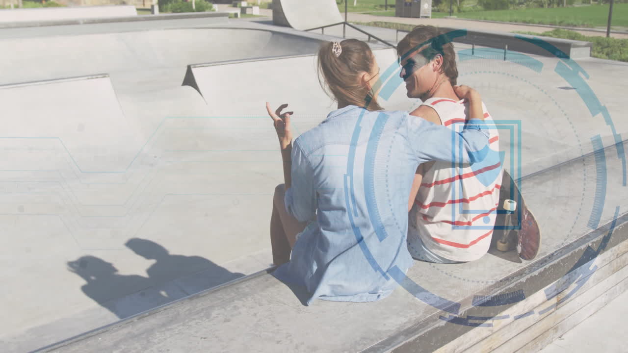 Young couple sitting at skatepark with digital interface animation overlay