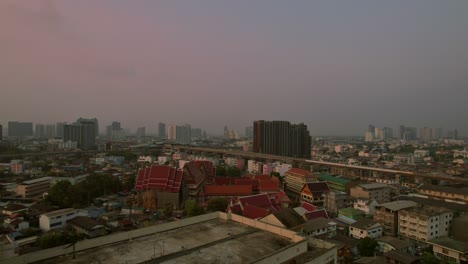 bangkok skyline at sunset with soft light and cityscape , aerial view