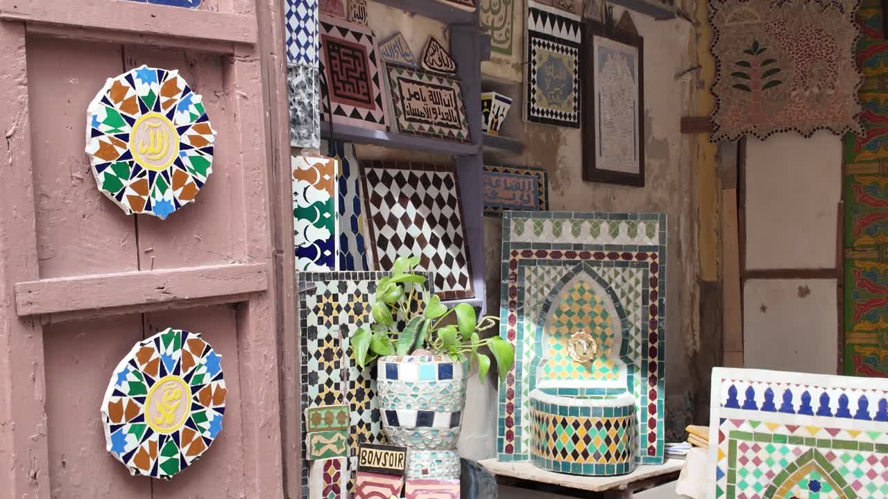 Colorful and intricate handcrafted tiles displayed in the Medina of Meknes, Morocco