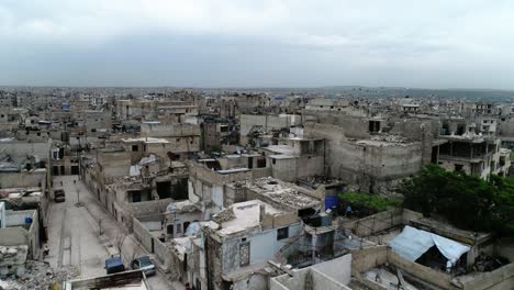 a syrian city in aerial. some of the buildings are still in ruins after the civil war 10 years ago 4k