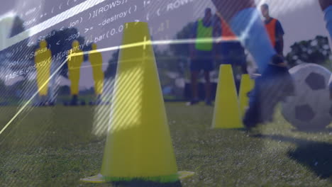 programming code animation over soccer training with yellow cones on grass field