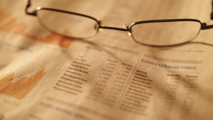 Eyeglasses On Newspaper Listing Stock Exchange