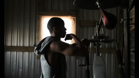 african american male boxer practicing boxing in fitness studio 4k