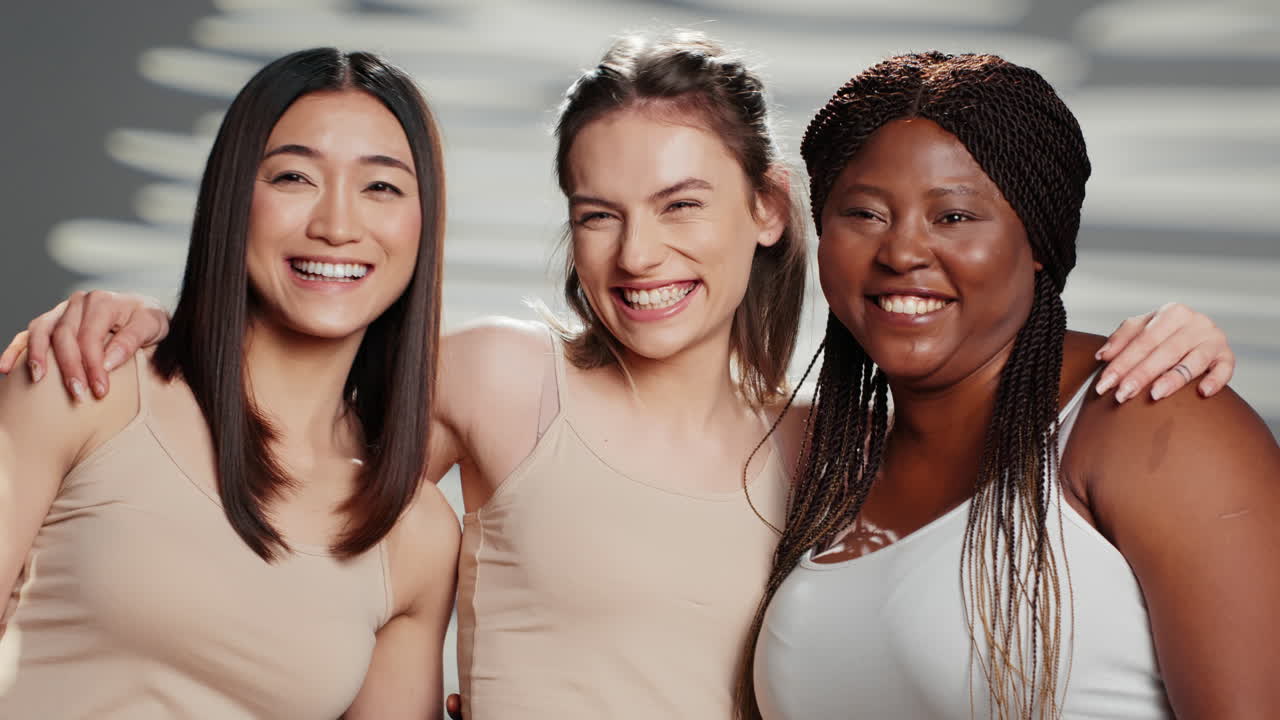 Diverse Group of Women Smiling and Embracing Each Other