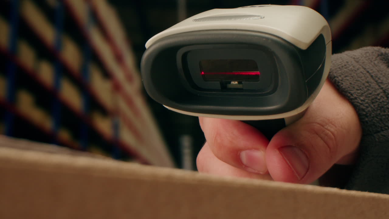 Scanner scan delivery box in storage, E-commerce shop, man packing goods and clothes second hand delivery market, courier Packaging and Shipping Workspace with Supplies and Technology, online sales.