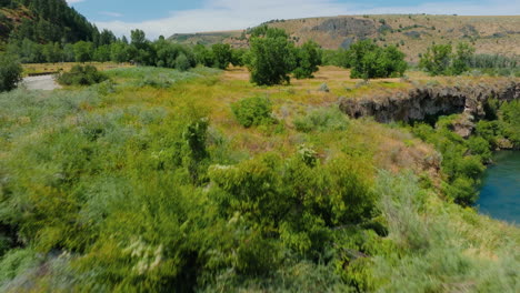 scenic waterfalls, river, and lush green landscapes