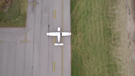 aerial view of the airplane on take-off or landing approach at the airport runway