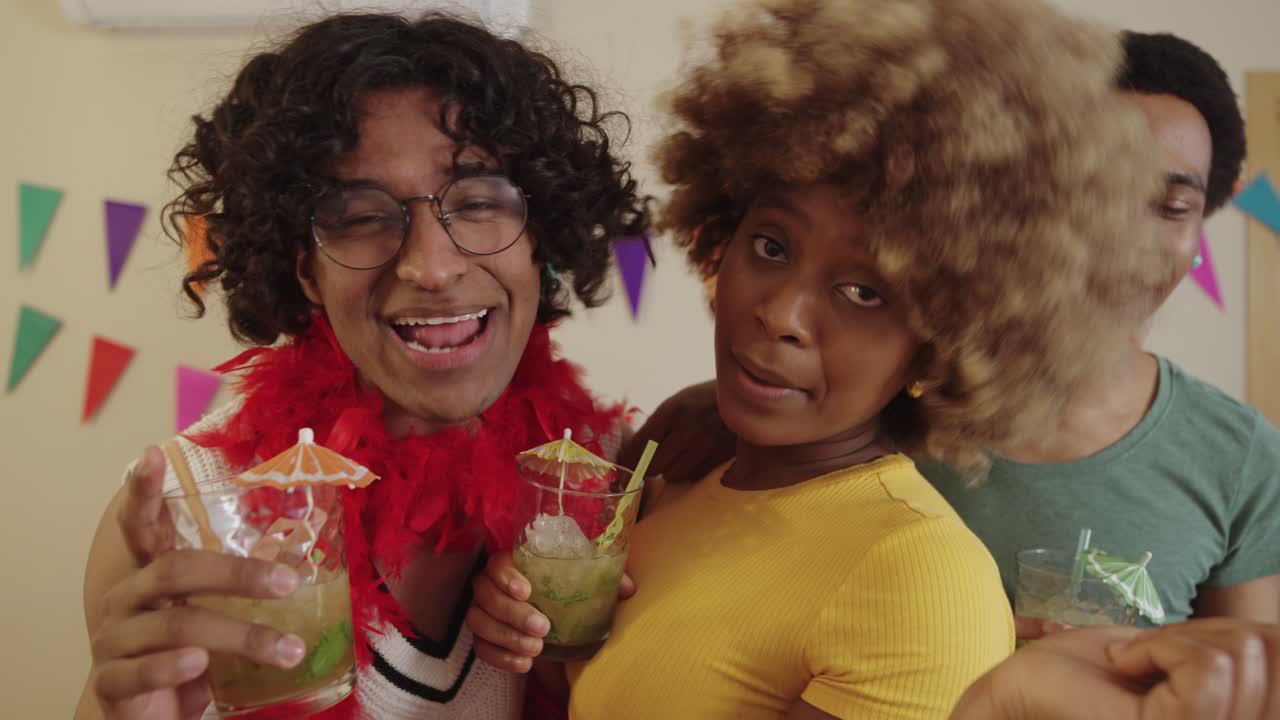 Friends celebrating with cocktails at a party