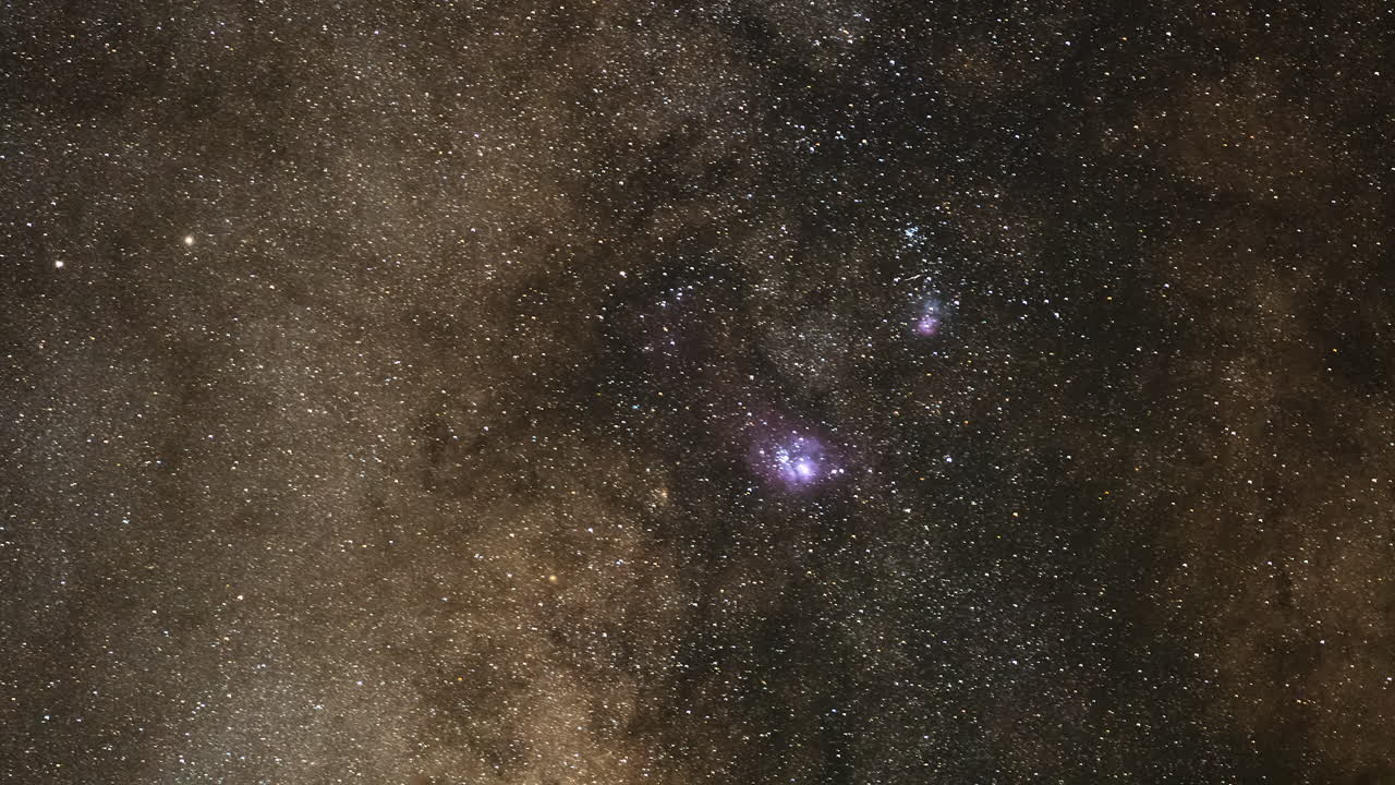 Dramatic Night Sky Filled with Bright Stars Moving in a Timelapse View