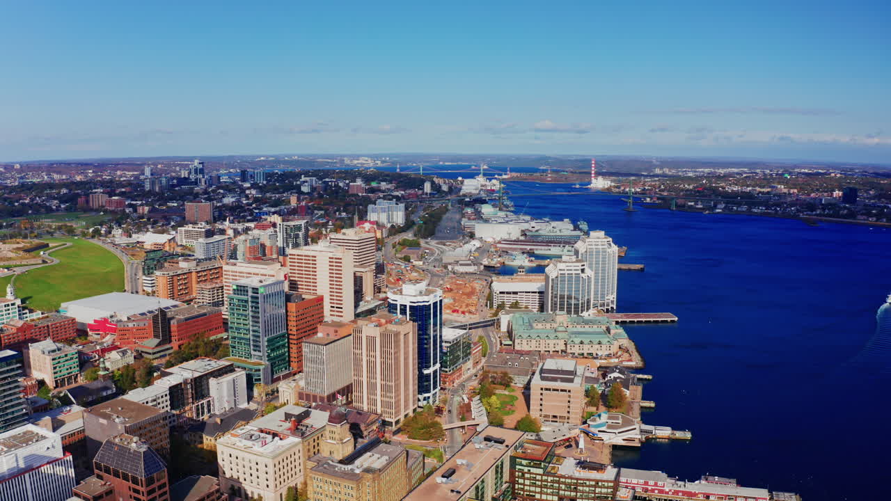 Aerial drone shot over Halifax downtown, Nova Scotia, Canada.
High view of the cityscape, ocean and the urban buildings.