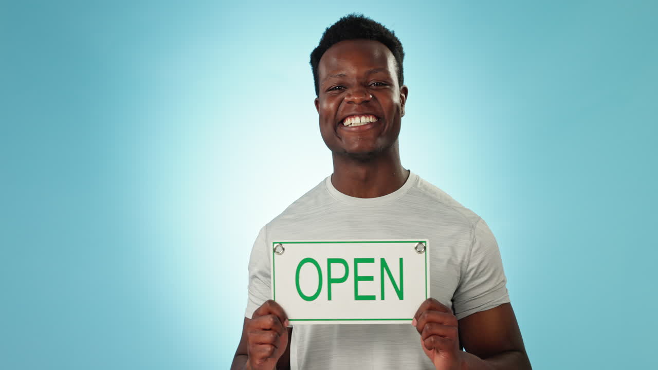 Happy black man, open sign