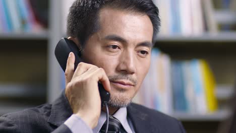 asian corporate executive working in office