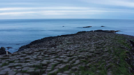 Geology---Amazing-Natural-Basalt-Column-Rock-Formation-on-Northern-Ireland-Coast,-Aerial