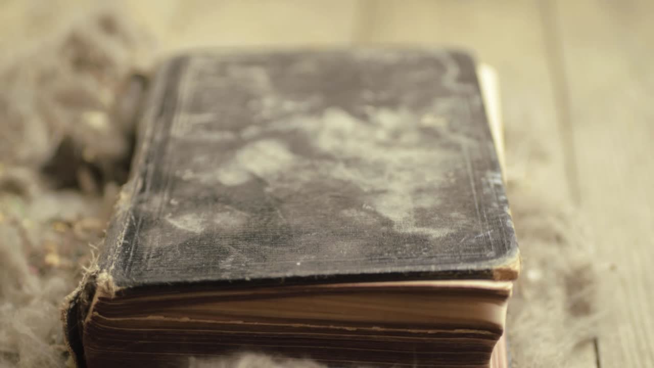 Wind blowing the pages of a dirty dusty old book