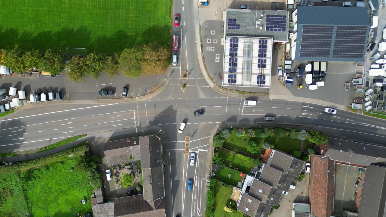 Urban green city highway road junction, Commercial roof with solar panels, Dusseldorf, Overhead aerial view