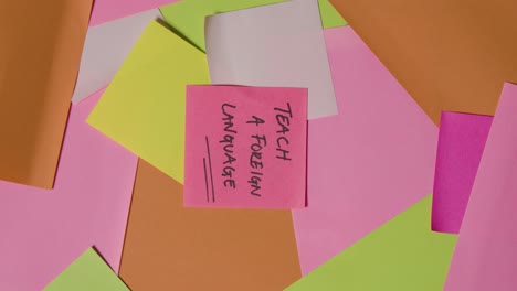 Education-Concept-Of-Revolving-Sticky-Notes-With-Teach-A-Foreign-Language-Written-On-Top-Note-1