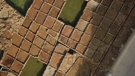 Aerial-view-of-the-salt-pans-at-Xwejni-bay,-Gozo,-Malta