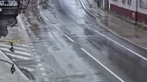 A-stunning-timelapse-of-a-rain-drenched-street,-featuring-blurred-cars-in-motion,-traffic-in-city