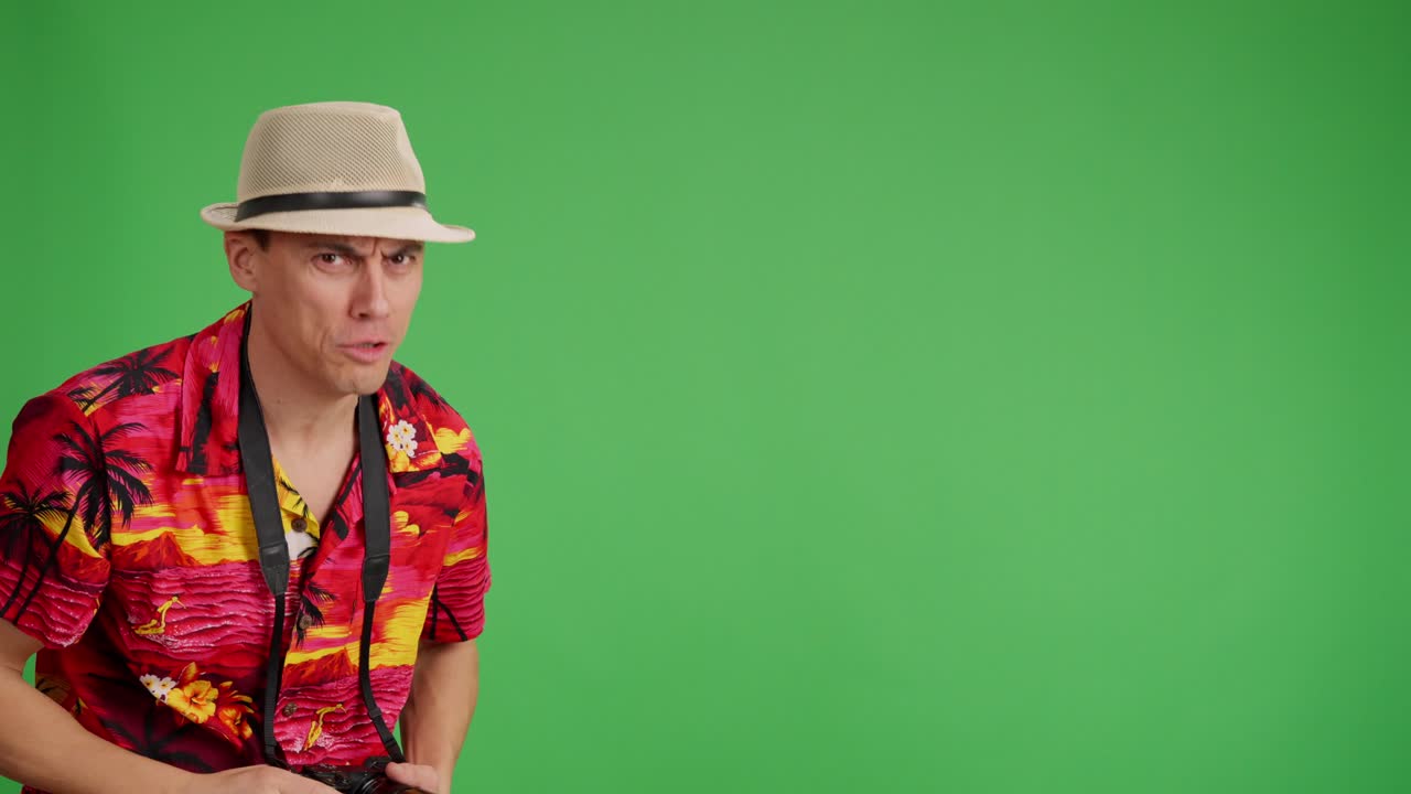 Tourist pointing, looking, and reacting on green screen background