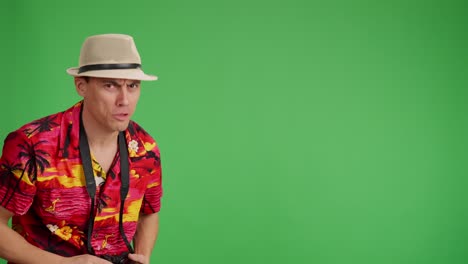 tourist pointing, looking, and reacting on green screen background