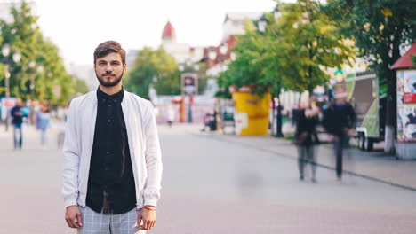 man standing in a city street