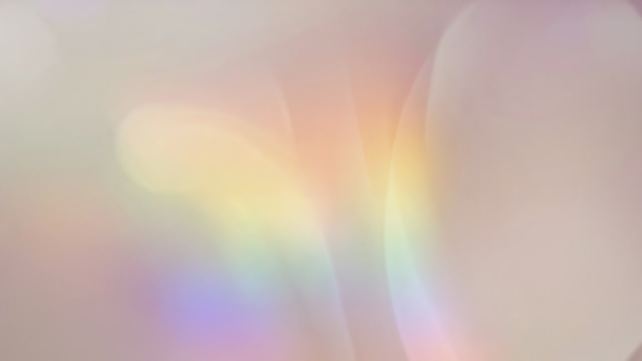 Pulsing blurred pastel arcs shifting across beige-pink field after pulse, calming with bokeh