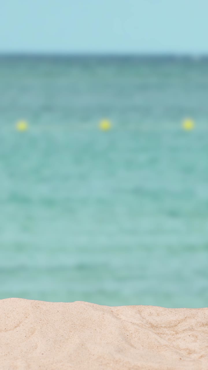 Vertical Video Summer Holiday Concept With Sandy Beach In Foreground Against Sea Background
