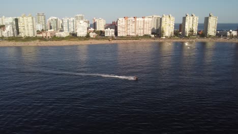 Aerial-View-Of-Jet-Ski-On-Uruguay-Coastline,-Punta-Del-Este