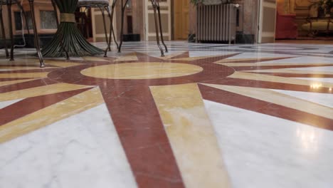 Low-Rotating-Shot-Of-A-Abstract-Design-On-The-Marble-Floor-Within-A-Mansion-In-Montpellier