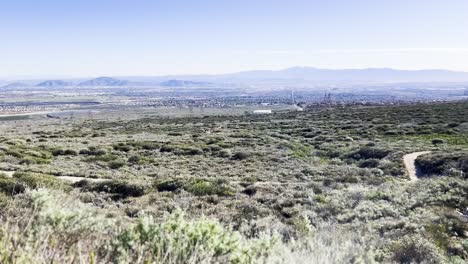 high desert at angeles national forest overlooking the valley with mountain ranges in the distance
