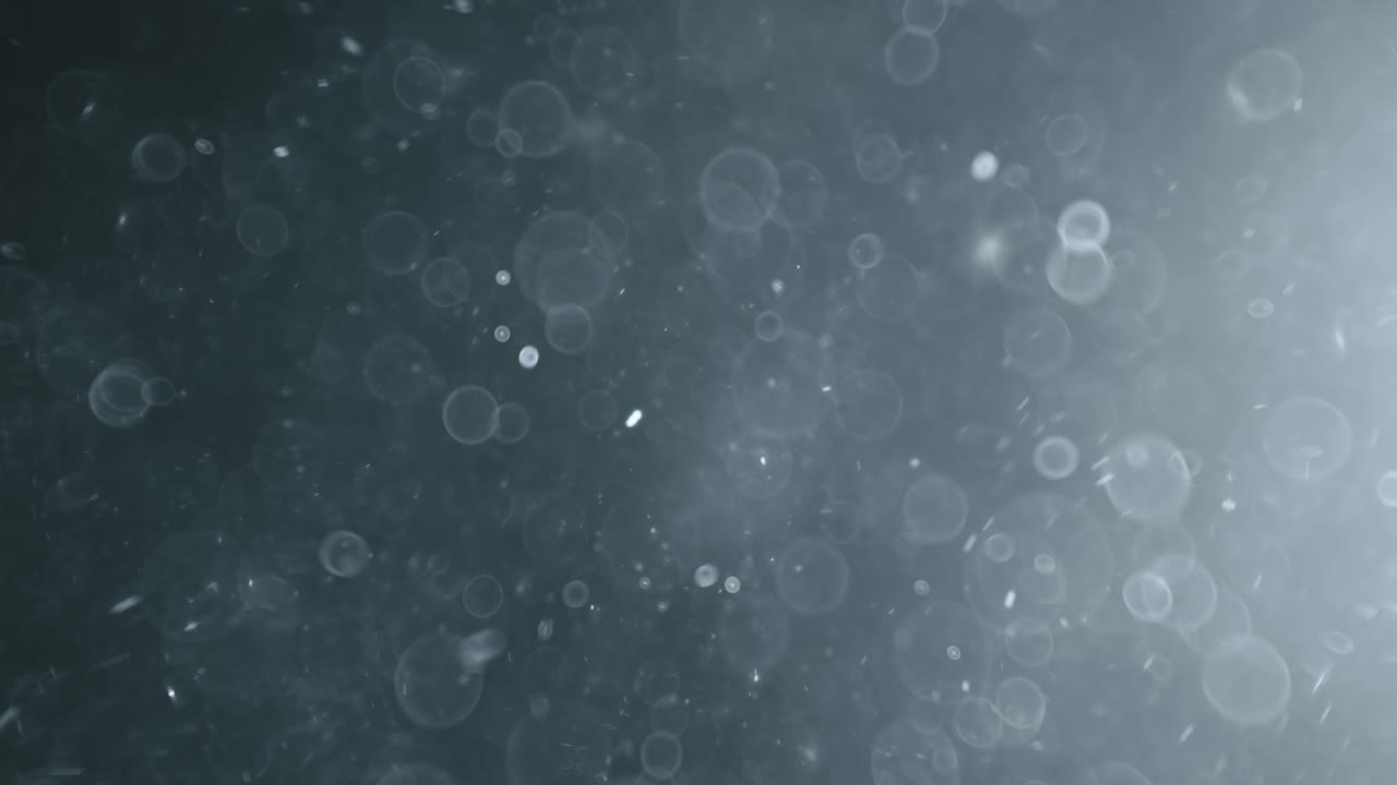 bokeh de partículas abstractas flotantes sobre fondo oscuro