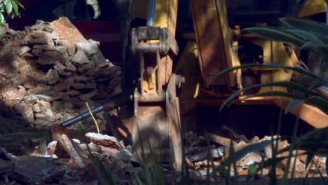 Construction machinery dealing with concrete rubble. Industry processes