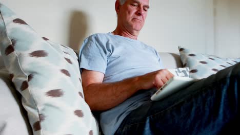 Senior-man-using-digital-tablet-in-bedroom-4k