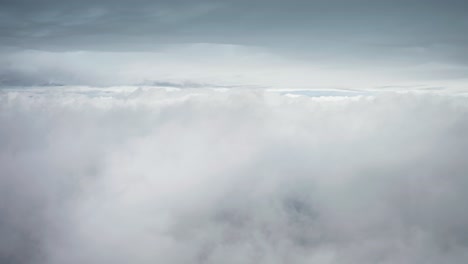 flying above white clouds