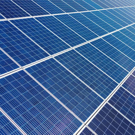 solar power panel. green energy. electricity. power energy panels. solar batteries in field on sunny day. aerial view. selective crop video focus.